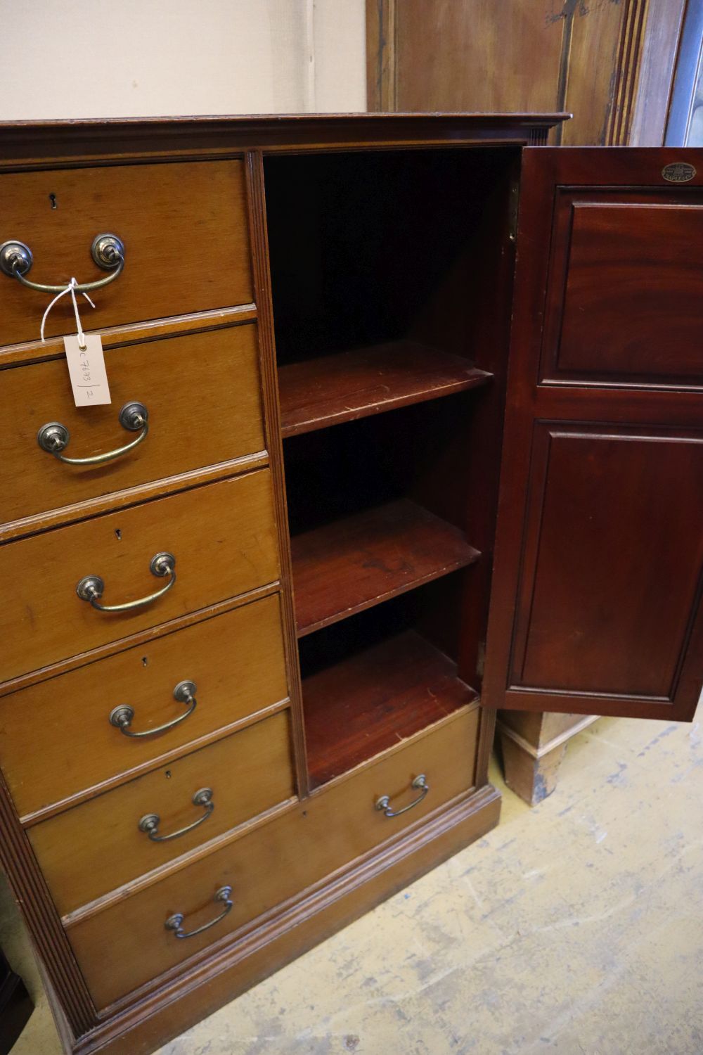 An Edwardian Maple & Co. compactum wardrobe, width 93cm